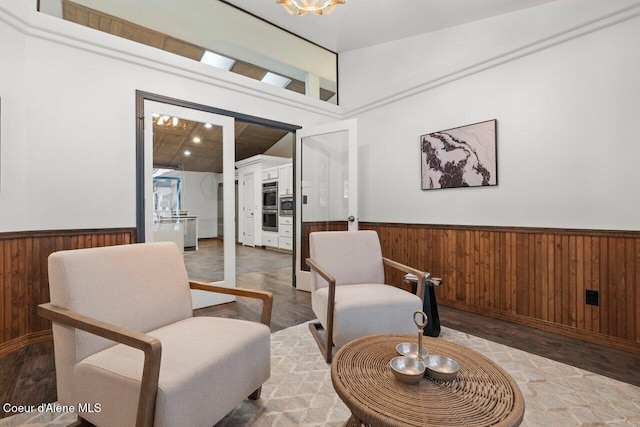 living area with hardwood / wood-style floors