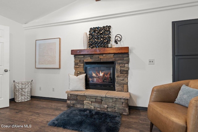 living room featuring a fireplace, dark hardwood / wood-style flooring, and lofted ceiling