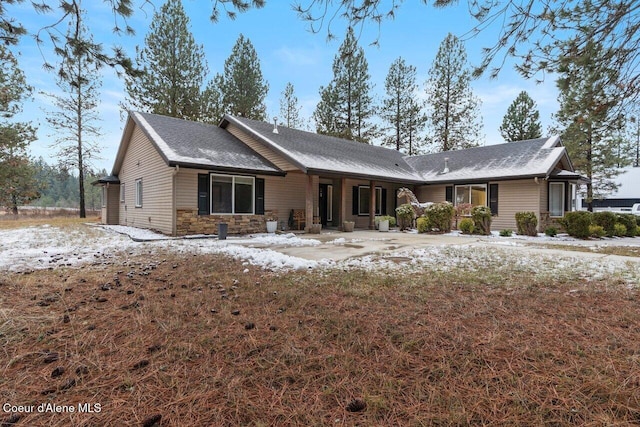 view of snow covered house