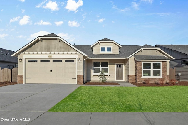 craftsman-style house with a front yard and a garage