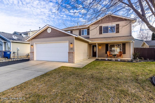 view of front of house featuring a porch, a garage, and a front yard