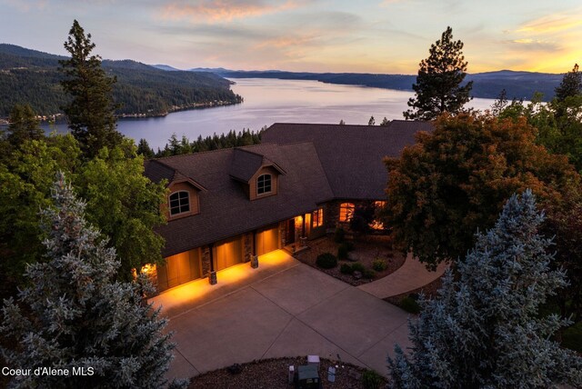 13277 S Ridgeview Loop, Harrison, ID 83833 - view of front of home with a water and mountain view and concrete driveway