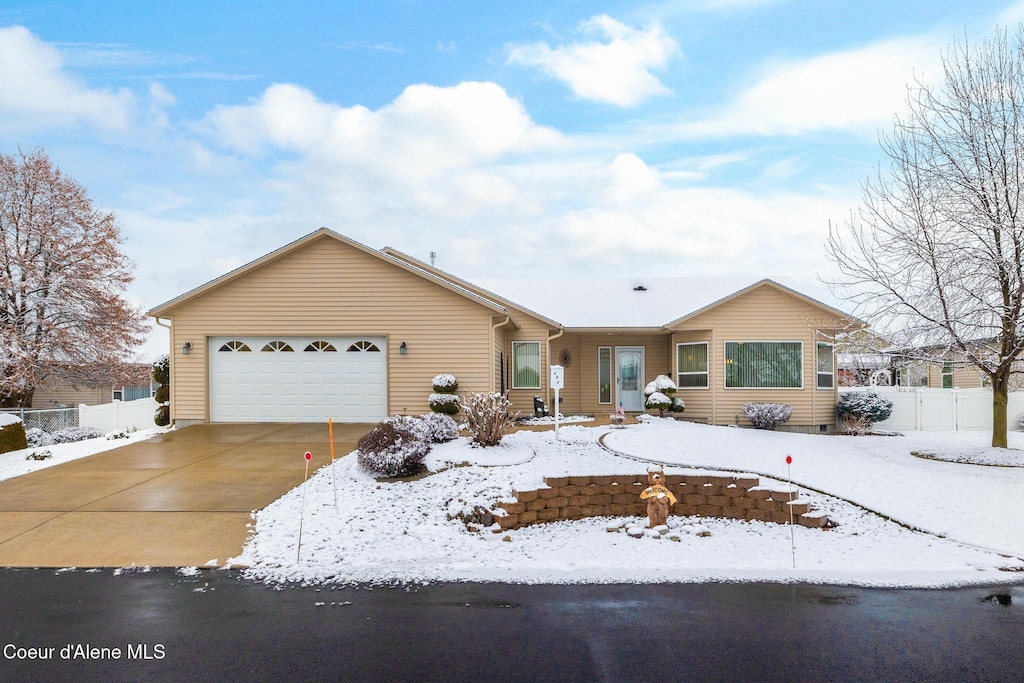 single story home featuring a garage