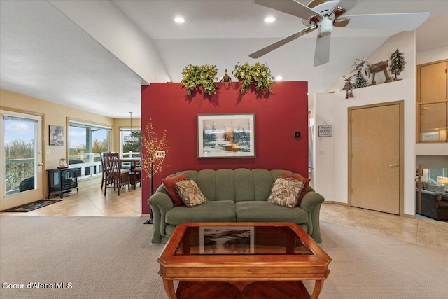 carpeted living room featuring ceiling fan