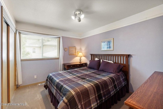 bedroom featuring crown molding and carpet floors