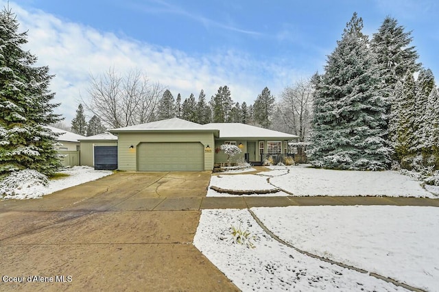 ranch-style house featuring a garage