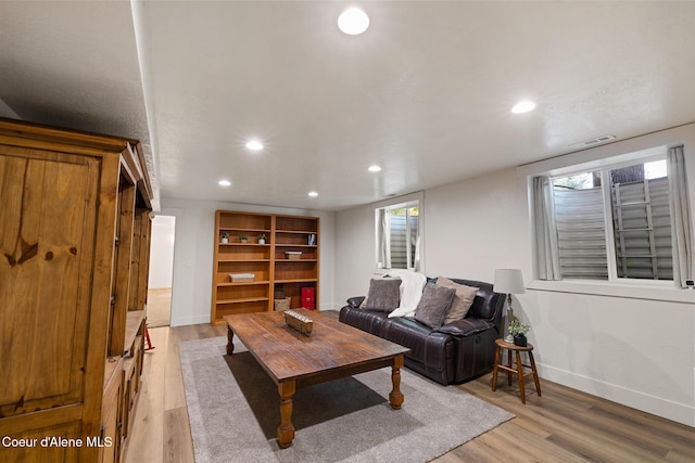 living room with light hardwood / wood-style flooring