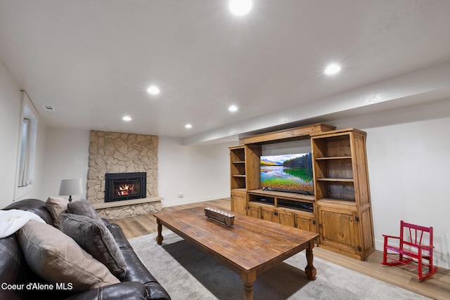 living room with a fireplace and light hardwood / wood-style floors