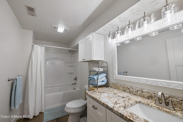 full bathroom with hardwood / wood-style flooring, vanity, toilet, and shower / bath combo with shower curtain