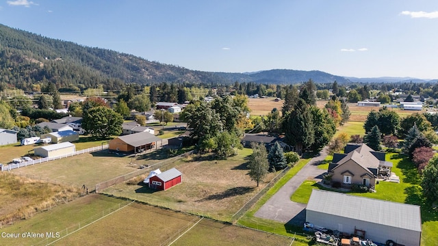 birds eye view of property featuring a mountain view