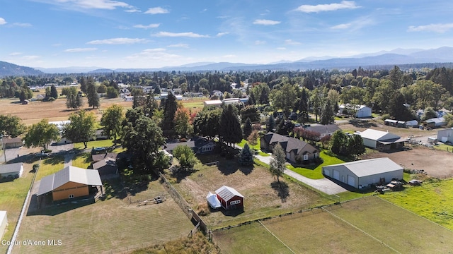 birds eye view of property with a mountain view