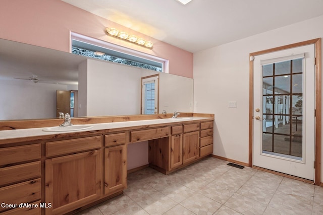 bathroom with vanity and ceiling fan