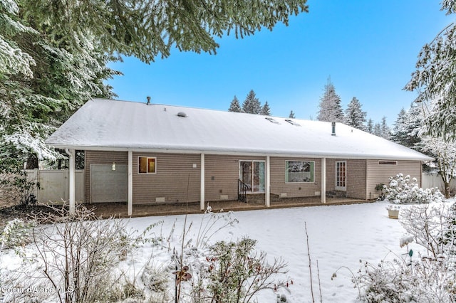 view of snow covered house