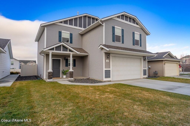 view of front of property with a garage and a lawn