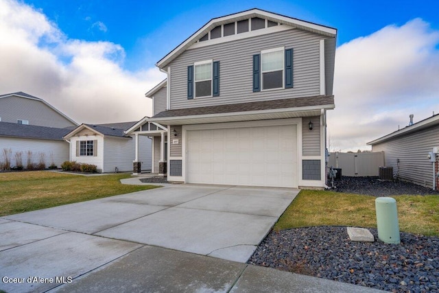 front facade featuring a garage, a front lawn, and central AC