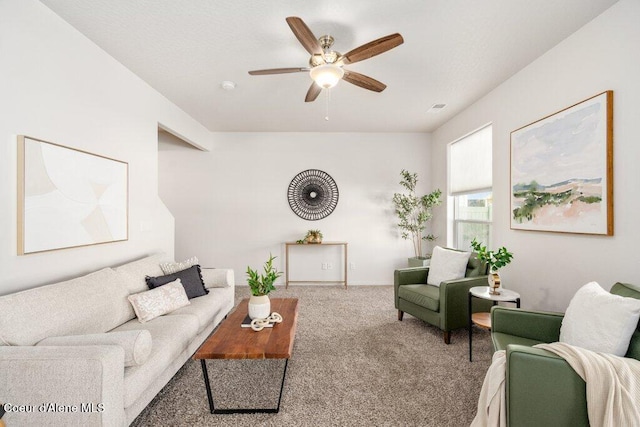 living room with carpet and ceiling fan