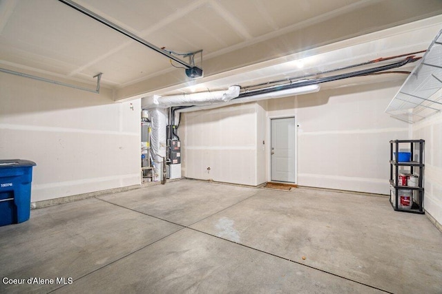 garage featuring a garage door opener, heating unit, and gas water heater