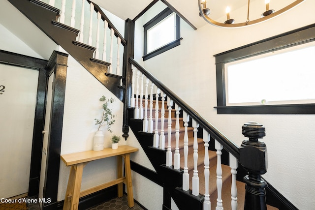 stairs featuring tile patterned flooring