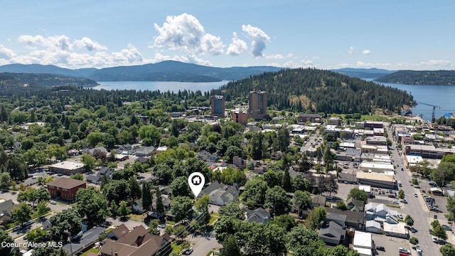 aerial view featuring a water and mountain view