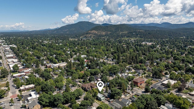 birds eye view of property featuring a mountain view