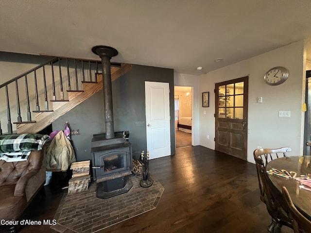 living room with a wood stove and dark hardwood / wood-style floors