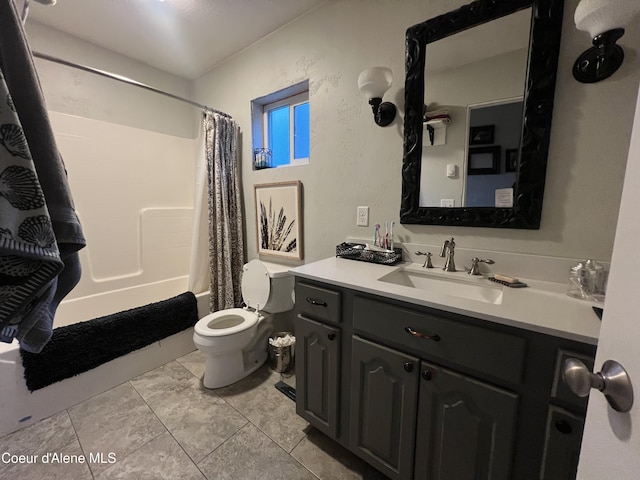 full bathroom featuring toilet, tile patterned floors, shower / bath combo, and vanity