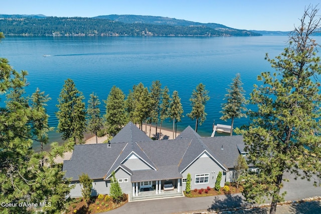 birds eye view of property featuring a water and mountain view