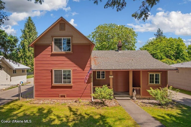 front of property featuring a porch and a front yard