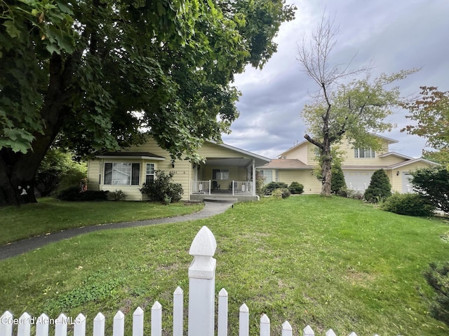 view of front facade with a porch and a front lawn