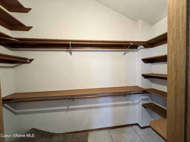 spacious closet featuring vaulted ceiling