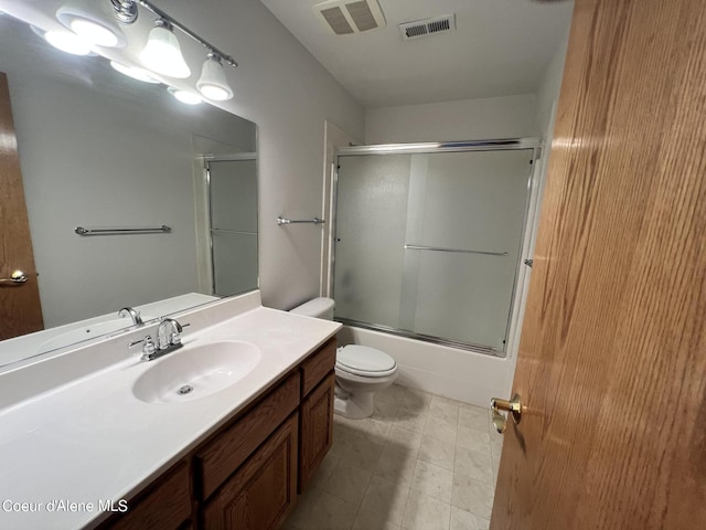 full bathroom with toilet, bath / shower combo with glass door, and vanity