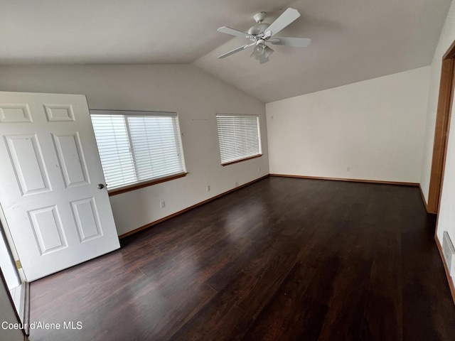 interior space with lofted ceiling, ceiling fan, and dark hardwood / wood-style floors