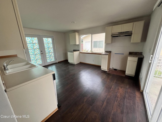 kitchen featuring sink, french doors, white cabinets, and dark hardwood / wood-style floors