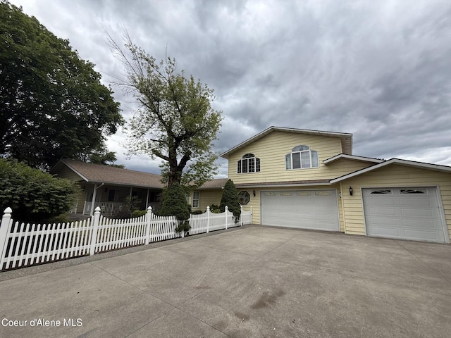 6344 N Colfax St, Dalton Gardens, ID 83815 - view of front facade featuring concrete driveway and an attached garage