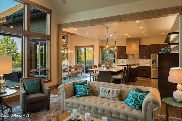 living room featuring hardwood / wood-style floors and lofted ceiling