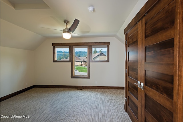 bonus room with carpet, vaulted ceiling, and ceiling fan