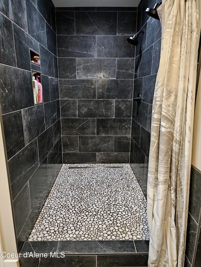 bathroom with a shower with curtain