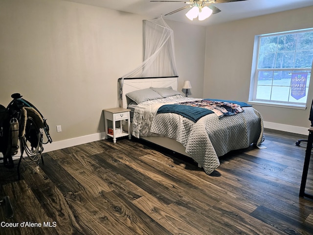 bedroom with ceiling fan and dark hardwood / wood-style flooring