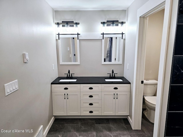 bathroom with vanity and toilet