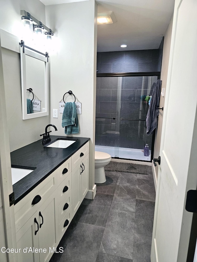 bathroom with vanity, toilet, and walk in shower