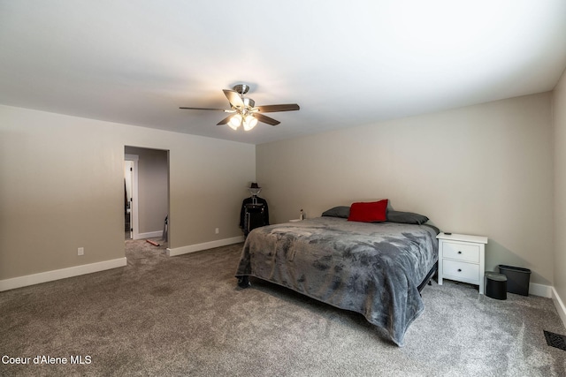 carpeted bedroom with baseboards, visible vents, and a ceiling fan