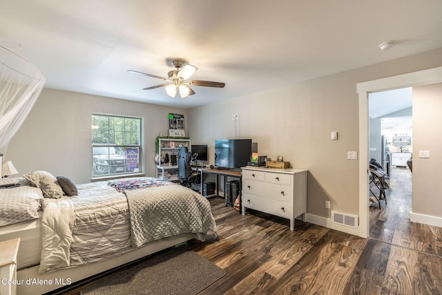 bedroom featuring visible vents, ceiling fan, wood finished floors, and baseboards