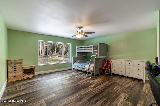 bedroom with baseboards, wood finished floors, and a ceiling fan