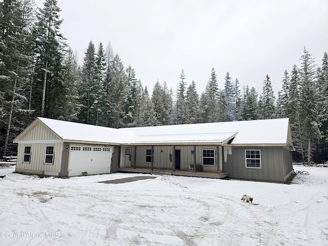 view of front of house with board and batten siding and an attached garage