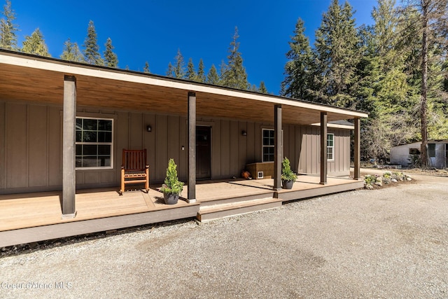 view of front facade featuring board and batten siding and a porch