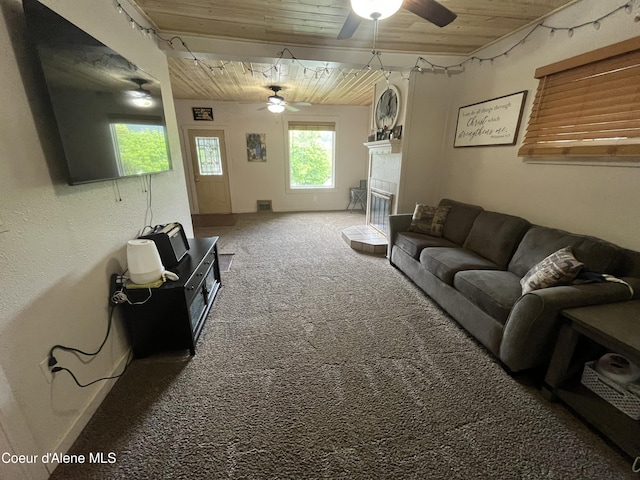 living room with ceiling fan, wood ceiling, and carpet floors