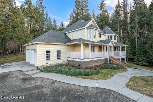 view of front of property featuring a garage and covered porch