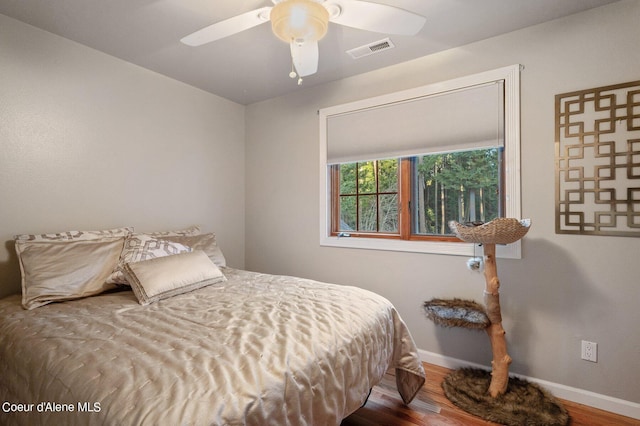 bedroom featuring ceiling fan and wood-type flooring