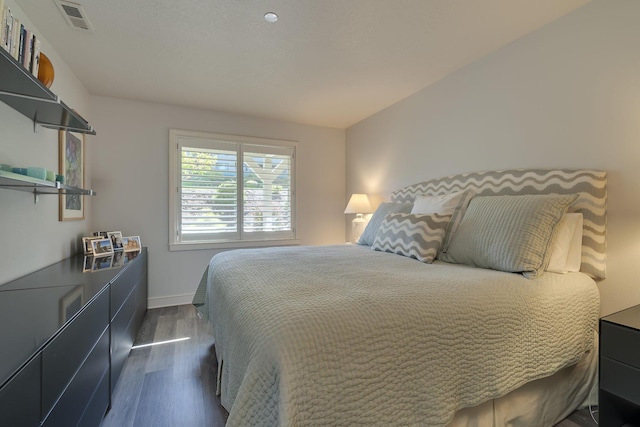 bedroom featuring dark hardwood / wood-style floors