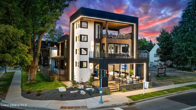 contemporary home featuring outdoor lounge area and a balcony